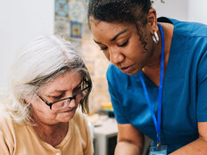Nurse assisting senior patient