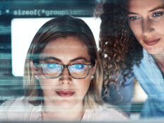 IT staff look at malicious code