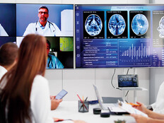 healthcare professionals participate in a hybrid meeting