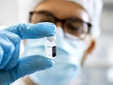 Pharmaceutical worker reviewing vaccine