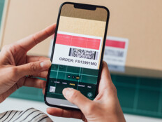 person scans barcode with phone