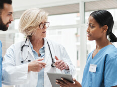 Care Team Collaborates with Data on Tables