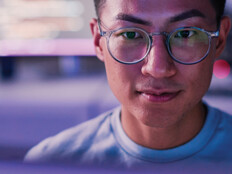 IT expert looks at monitor