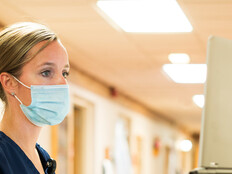 Doctor using medical laptop in hospital