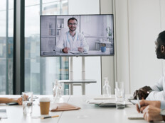 care team speaks with physician over conference call