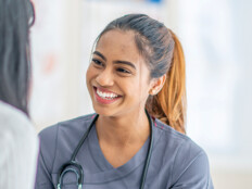nurse smiling at patient