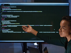 IT specialists meet and look at code