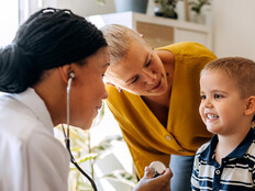 Pediatrician working with patient