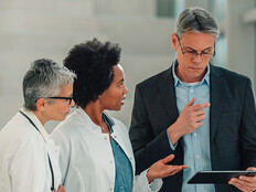 healthcare executive collaborates with physicians