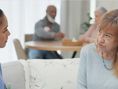 nurse talks to senior