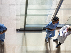 aerial view of doctors and nurses entering a hospital