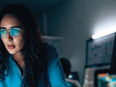 cybersecurity expert surrounded by code