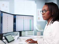 doctor on computer deals with healthcare billing