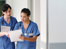 nurses with paper charts