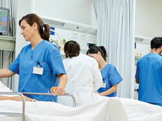 nurses talk to patients on gurneys