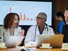 clinicians and IT team meeting