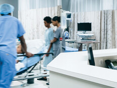 Nurses pushing hospital gurney
