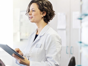 Doctor using tablet in office