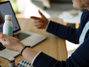 woman consults a doctor through a virtual visit