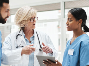 Care Team Collaborates with Data on Tables