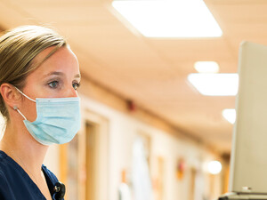 Doctor using medical laptop in hospital