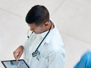 Doctor reviewing health record