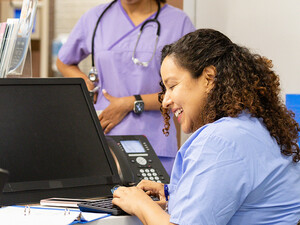 Nurse working at the front desk of a hospital