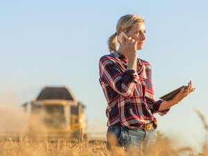 Person in rural setting talking on phone