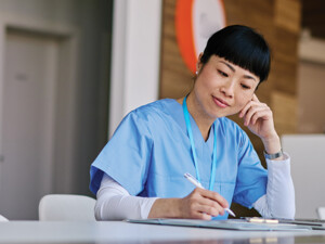 nurse studying on computer