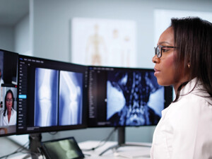 doctor on conference call with care team