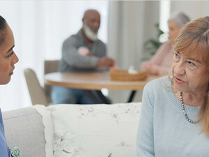 nurse talks to senior