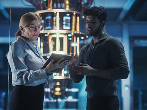 Two people in a tech facility