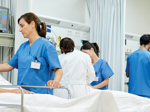 nurses talk to patients on gurneys