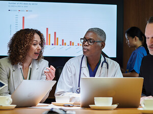 clinicians and IT team meeting