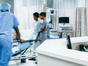 Nurses pushing hospital gurney
