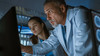 two doctors assess MRI images