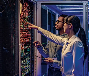 two IT experts assess a data center