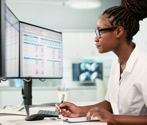 Women at desk working on computer
