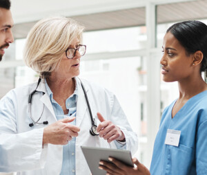 Care Team Collaborates with Data on Tables