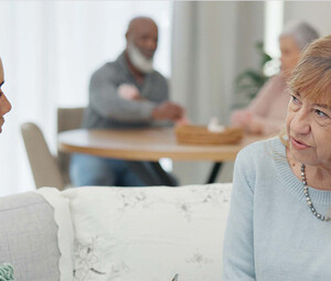 nurse talks to senior