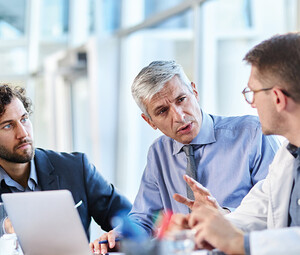 healthcare team have discussion around table